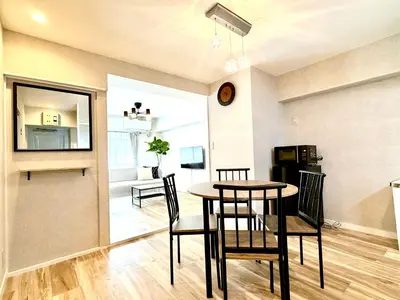 a dining room and living room with a table and chairs at #403 Tokyo Ryogoku Hokusai Katsushika in Tokyo