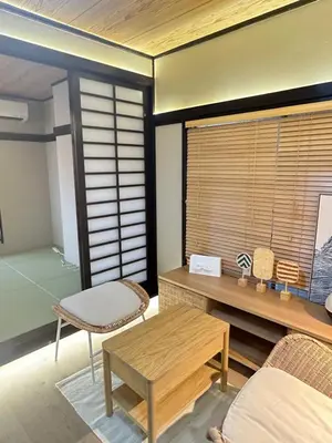 a living room with a table and a bench and a table sidx sidx at KYOSAI-Asakusa Q in Tokyo