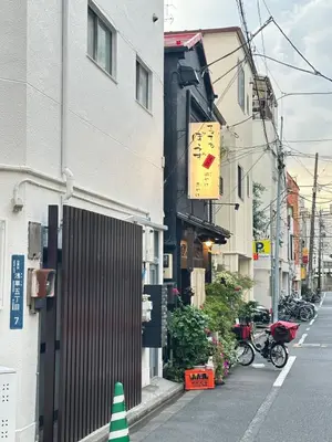 a city street with a building with a sign on it at KYOSAI-Asakusa Q in Tokyo