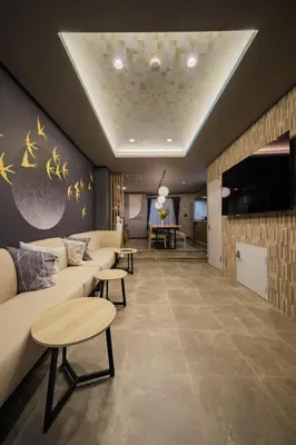 a living room with a couch and a table at Mitsuki in Tokyo