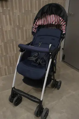 a blue stroller sitting in a room at Mitsuki in Tokyo