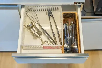 a drawer filled with utensils in a kitchen at 11 Under the Moon Shin-Okubo Station 3 minute walk in Tokyo