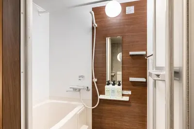 a bathroom with a bath tub and a sink at Cozy 1BR Apt in Asakusa-8 min walk Naka Okachimachi station in Tokyo