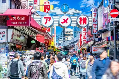 a crowd of people walking down a busy city street at Cozy 1BR Apt in Asakusa-8 min walk Naka Okachimachi station in Tokyo