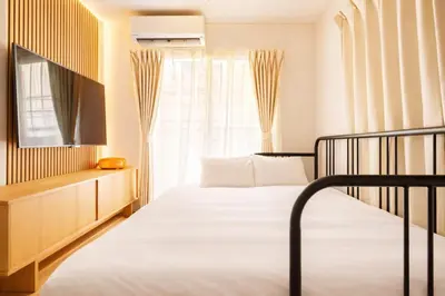 a bedroom with a bed and a window at Shinjuku Large Entire 3Story House for 9 Near 2 Stations in Tokyo