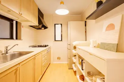 a large kitchen with a sink and a refrigerator at Shinjuku Large Entire 3Story House for 9 Near 2 Stations in Tokyo