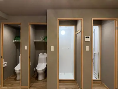 a bathroom with two doors and a toilet at Shinjuku Station kabukicho 2minutes big House in Tokyo