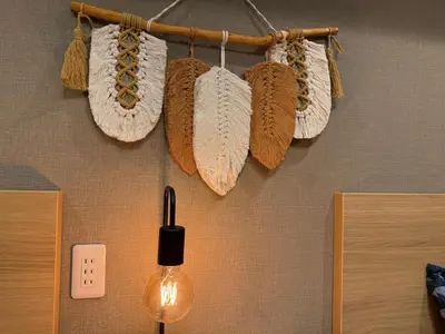 a bunch of knitted hats hanging on a wall at Shinjuku Station kabukicho 2minutes big House in Tokyo