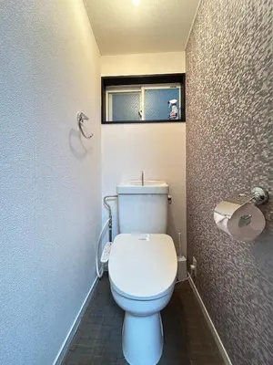 a bathroom with a white toilet with a window at HillTop Sendagi 102 in Tokyo