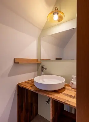 a bathroom with a sink and a mirror at -Gyokuran- 6-minute walk from Shin-Okubo Station in Tokyo