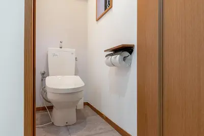 a bathroom with a white toilet in a room at -Gyokuran- 6-minute walk from Shin-Okubo Station in Tokyo