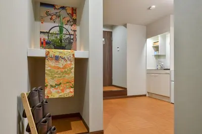 a living room with a hallway and a kitchen at Edo Art Hotel in Tokyo