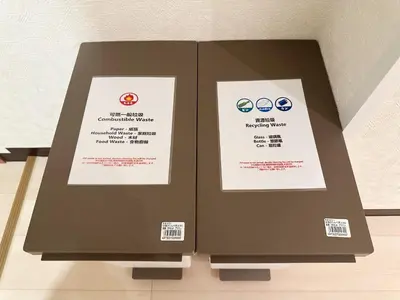 two boxes sitting on top of a table at The Travelers Court Bunkyo II in Tokyo