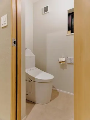 a bathroom with a white toilet in a room at NEW Hotel Komugi Skytree - modern Japanese-style guesthouse near Asakusa & Skytree 3mins, whole house rental perfect for large groups up to 14pax in Tokyo