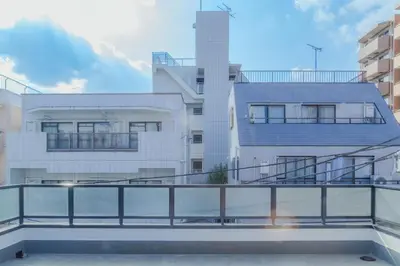 a view of a building from a balcony at ISSHUKU Noma \u5317\u65b0\u5bbfI -202 Triple Room in Tokyo