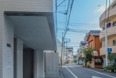 a building on a street with at ISSHUKU Noma \u5317\u65b0\u5bbfI -202 Triple Room in Tokyo
