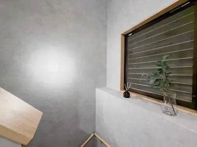 a plant in a vase sitting on a window sill at ISSHUKU Noma \u5317\u65b0\u5bbfI -202 Triple Room in Tokyo