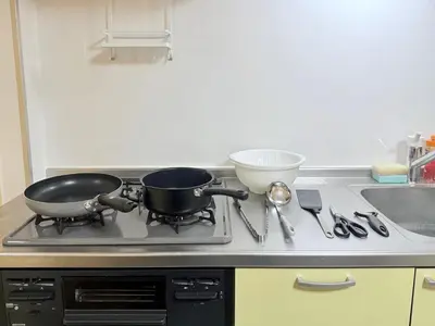 two pans sitting on top of a stove in a kitchen at Tokyo Stay Itabashi #202 in Tokyo