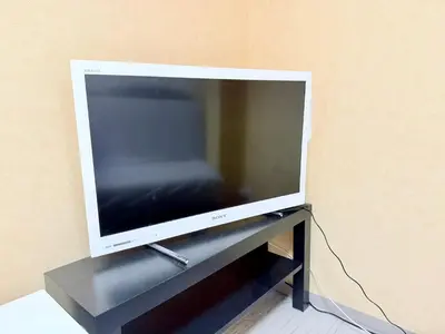a flat screen tv sitting on a black stand at Tokyo Stay Itabashi #202 in Tokyo