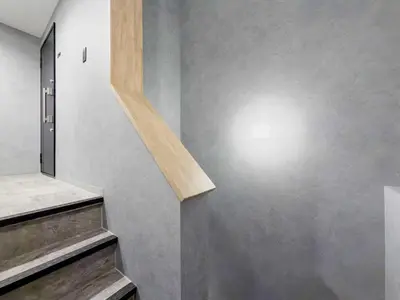 a stairwell with a light on a wall at ISSHUKU Noma \u5317\u65b0\u5bbfI -203 Triple Room in Tokyo