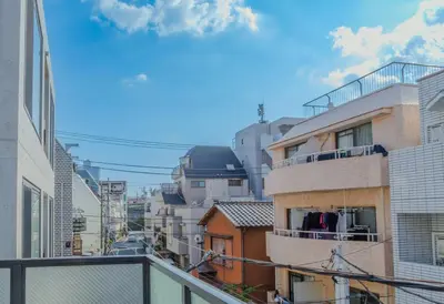 a view of a city from a balcony at ISSHUKU Noma \u5317\u65b0\u5bbfI -203 Triple Room in Tokyo