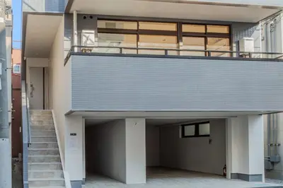 a building with a staircase and a balcony at ISSHUKU Noma \u5317\u65b0\u5bbfI -203 Triple Room in Tokyo