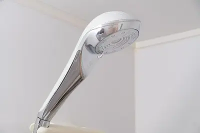 a ceiling fan hanging from a ceiling at White court Shinjuku203 in Tokyo