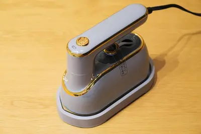 a cell phone sitting on top of a wooden table at White court Shinjuku203 in Tokyo
