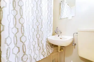 a bathroom with a sink and a shower curtain at 10 minutes to Shibuya by train, 2 beds, great access, Yoyogi Uehara in Tokyo