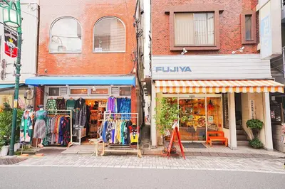 a store on the side of a city street with a store at 10 minutes to Shibuya by train, 2 beds, great access, Yoyogi Uehara in Tokyo