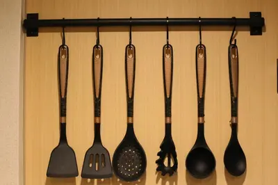a group of utensils hanging on a wall at Shibuya Shinjuku area Designer apartment in Tokyo