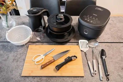 a cutting board with utensils on top of a counter at \u30db\u30c6\u30eb\u5bcc\u58eb\u898b\u30de\u30f3\u30b7\u30e7\u30f3301 in Tokyo