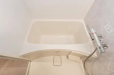 a white toilet in a bathroom with a white ceiling at Mi-HOTEL Kitashinjuku in Tokyo
