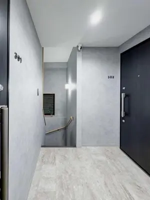 a hallway with a sliding door in a building at ISSHUKU Noma \u5317\u65b0\u5bbfI -301 Triple Room in Tokyo
