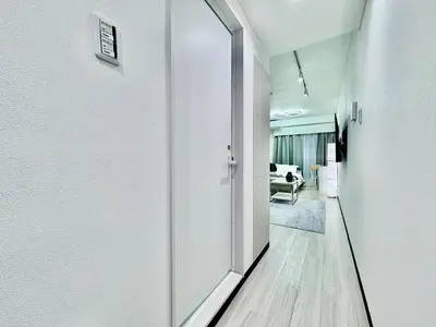 a hallway with a door leading to a room at Kabukicho Designer's Apt VIII in Tokyo