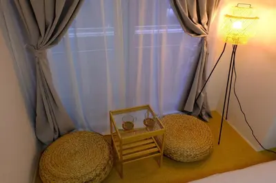 a room with two spheres and a lamp and a window at Shinjuku Kabukicho Apt XI in Tokyo