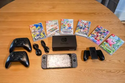 a table with nintendo wii games and video game controllers at 4min Shibuya Sta,3min Shinsen Sta,Central Shibuya,family-friendly,Switch, movies, Wi-Fi in Tokyo