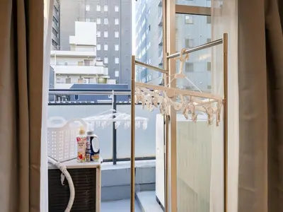 a balcony with a view of a city at 4min Shibuya Sta,3min Shinsen Sta,Central Shibuya,family-friendly,Switch, movies, Wi-Fi in Tokyo