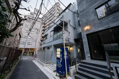 a blue phone booth in front of a building at 4min Shibuya Sta,3min Shinsen Sta,Central Shibuya,family-friendly,Switch, movies, Wi-Fi in Tokyo