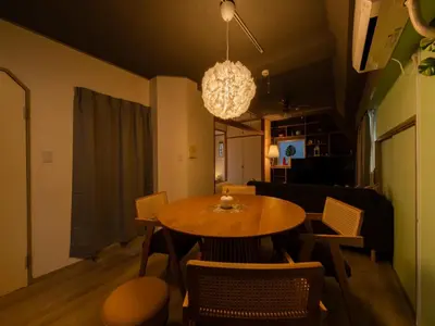 a dining room with a table and chairs at 4min Shibuya Sta,3min Shinsen Sta,Central Shibuya,family-friendly,Switch, movies, Wi-Fi in Tokyo