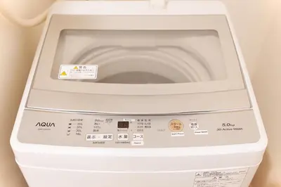 a washing machine with a toilet in a bathroom at House no7 in Tokyo
