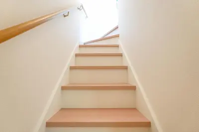 a staircase in a house with wooden steps at House no7 in Tokyo