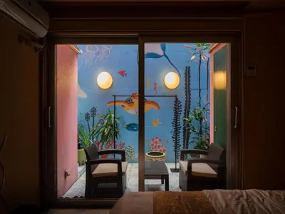 a room with an aquarium with a glass door at Roppongi sta 3min , Akasaka Sta, 3min,Family & Group Stay,WiFi, Switch,King bed in Tokyo