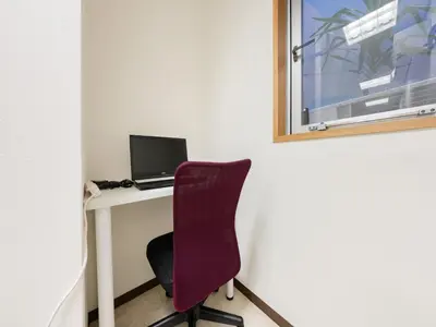 a desk with a laptop computer on it with a chair at Roppongi sta 3min , Akasaka Sta, 3min,Family & Group Stay,WiFi, Switch,King bed in Tokyo