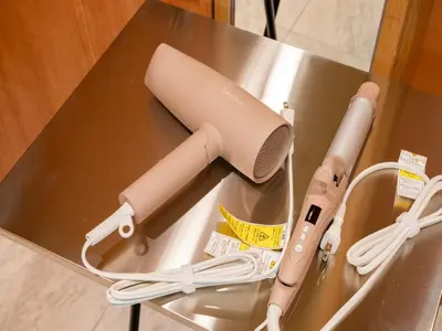 a hair dryer on a table with a wii remote at Roppongi sta 3min , Akasaka Sta, 3min,Family & Group Stay,WiFi, Switch,King bed in Tokyo