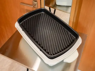 a black and white grill sitting on top of a table at Roppongi sta 3min , Akasaka Sta, 3min,Family & Group Stay,WiFi, Switch,King bed in Tokyo