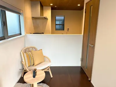 a living room with a chair and a table at Central Tokyo Skytree Heven in Tokyo