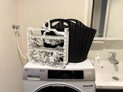 a basket sitting on top of a washing machine at Central Tokyo Skytree Heven in Tokyo