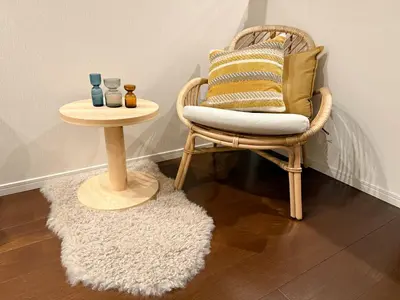 a wicker chair and a table with a side table at Central Tokyo Skytree Heven in Tokyo