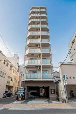 a tall apartment building on a city street at Louis stage asakusa in Tokyo
